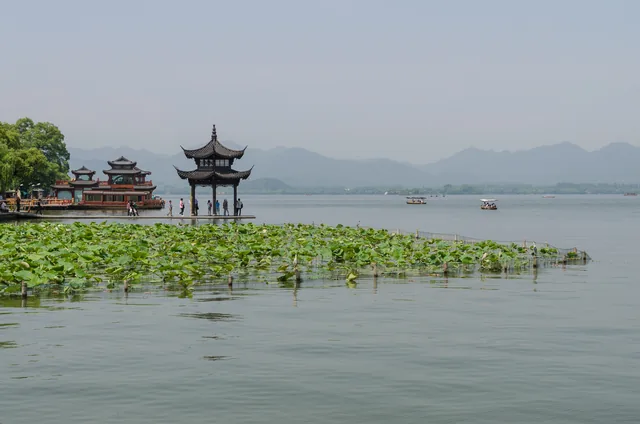 West Lake and green shoreline in Hangzhou.